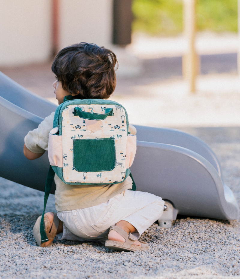 Baby holding backpack sales